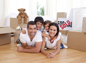 bigstock-Happy-Family-After-Buying-New--6181243